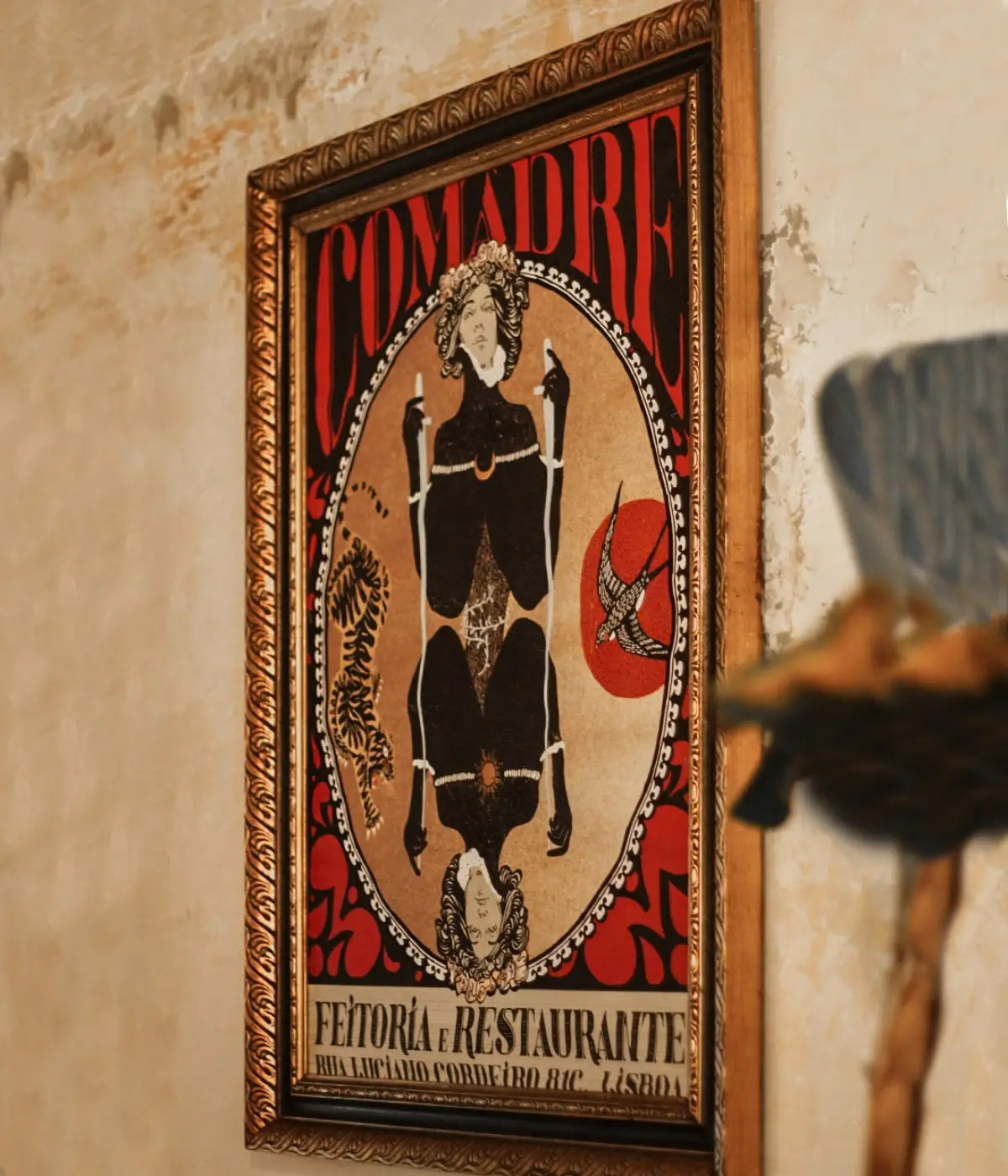 Ornate tapestry on a wall at Comadre